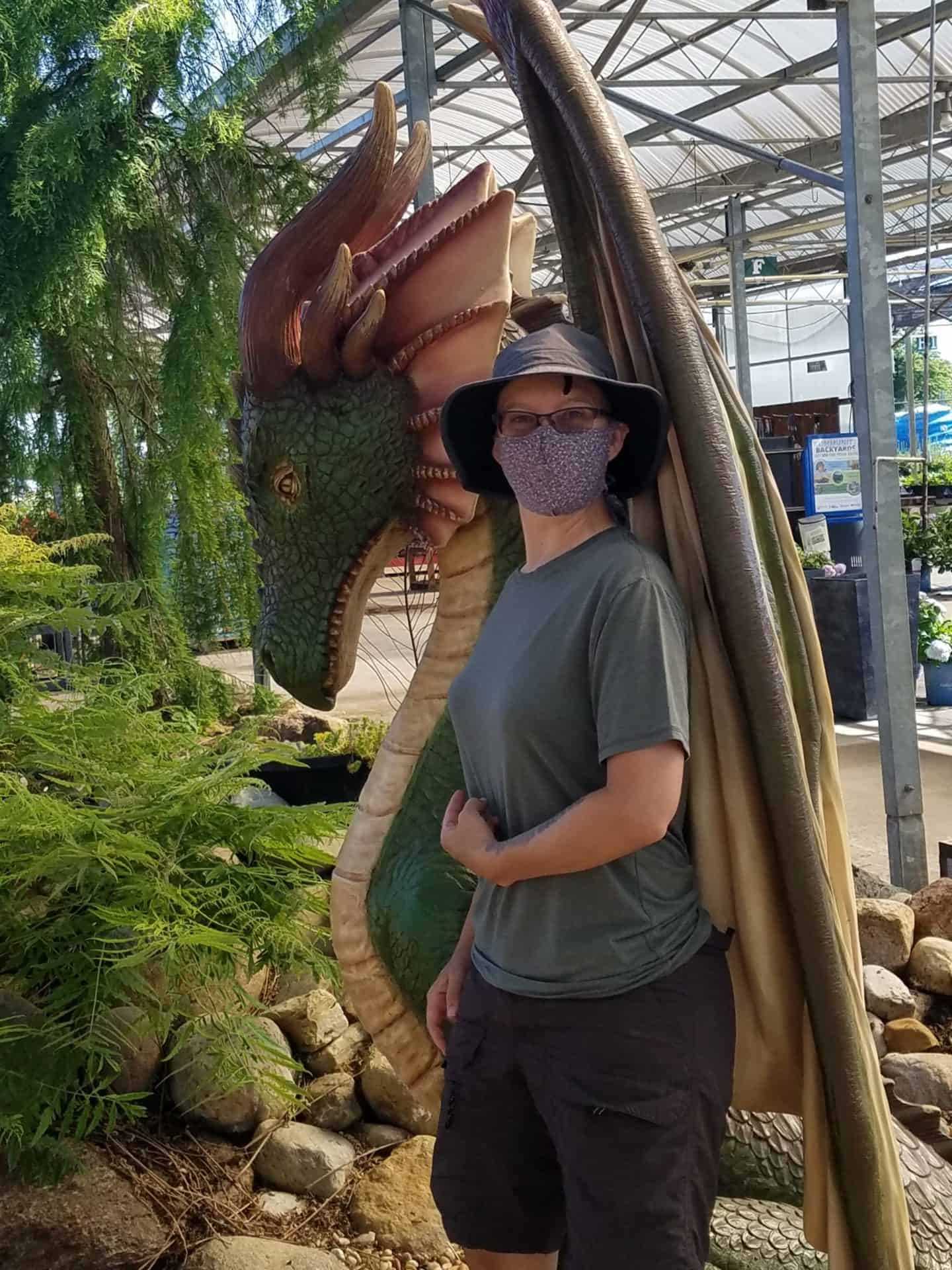 Author Standing Next to Dragon Statue